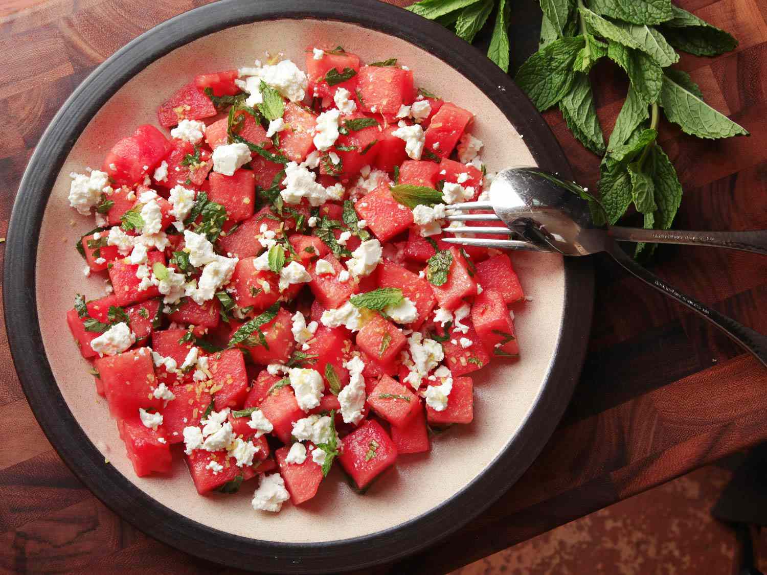 Watermelon and feta salad garnished with fresh mint