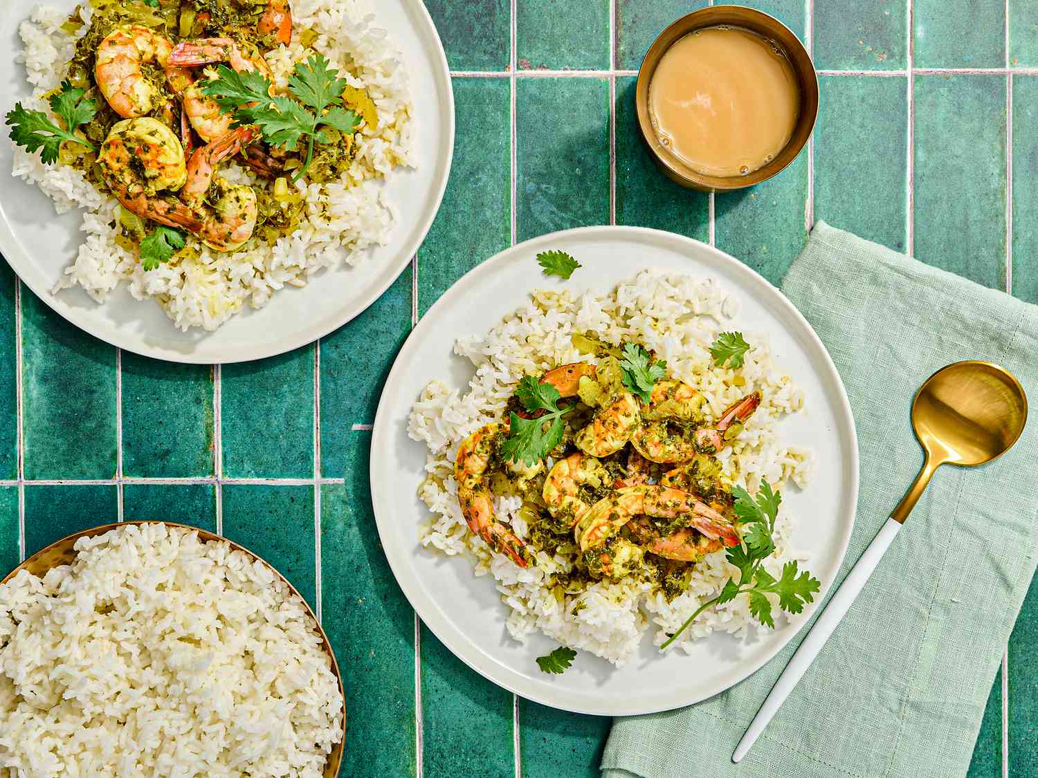 Overhead view of a plate of shrimp with cilantro sauce over rice