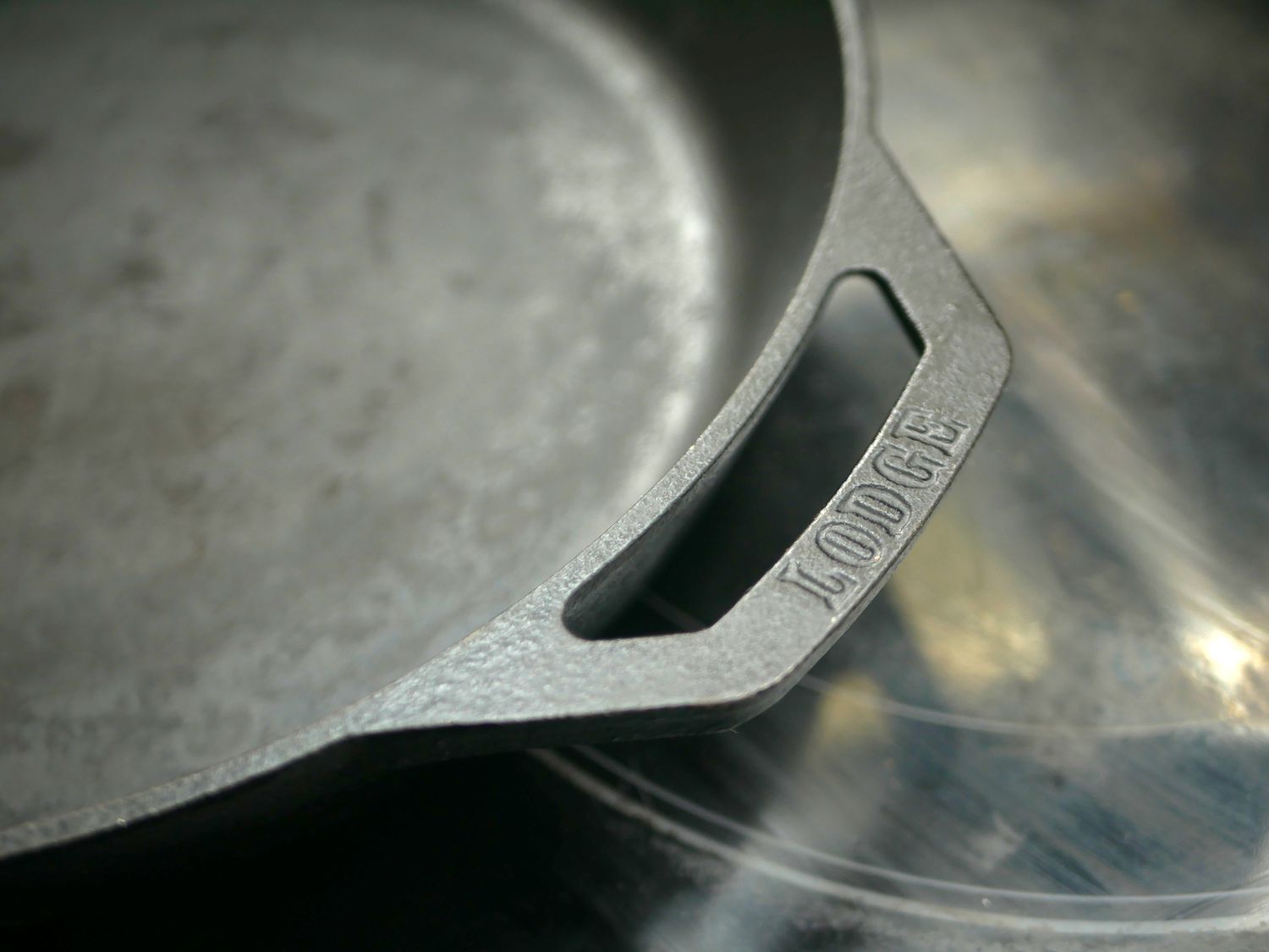 a closeup of one of the handles on the Lodge cast iron skillet
