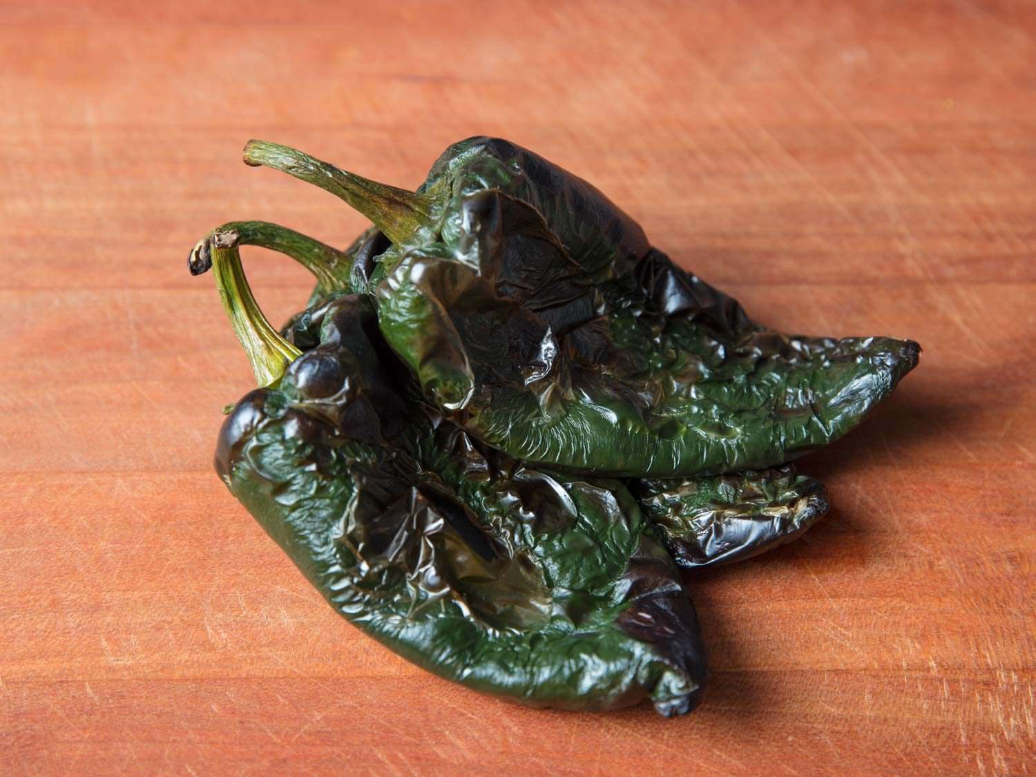 Roasted Poblano peppers, ready to peel and chop.