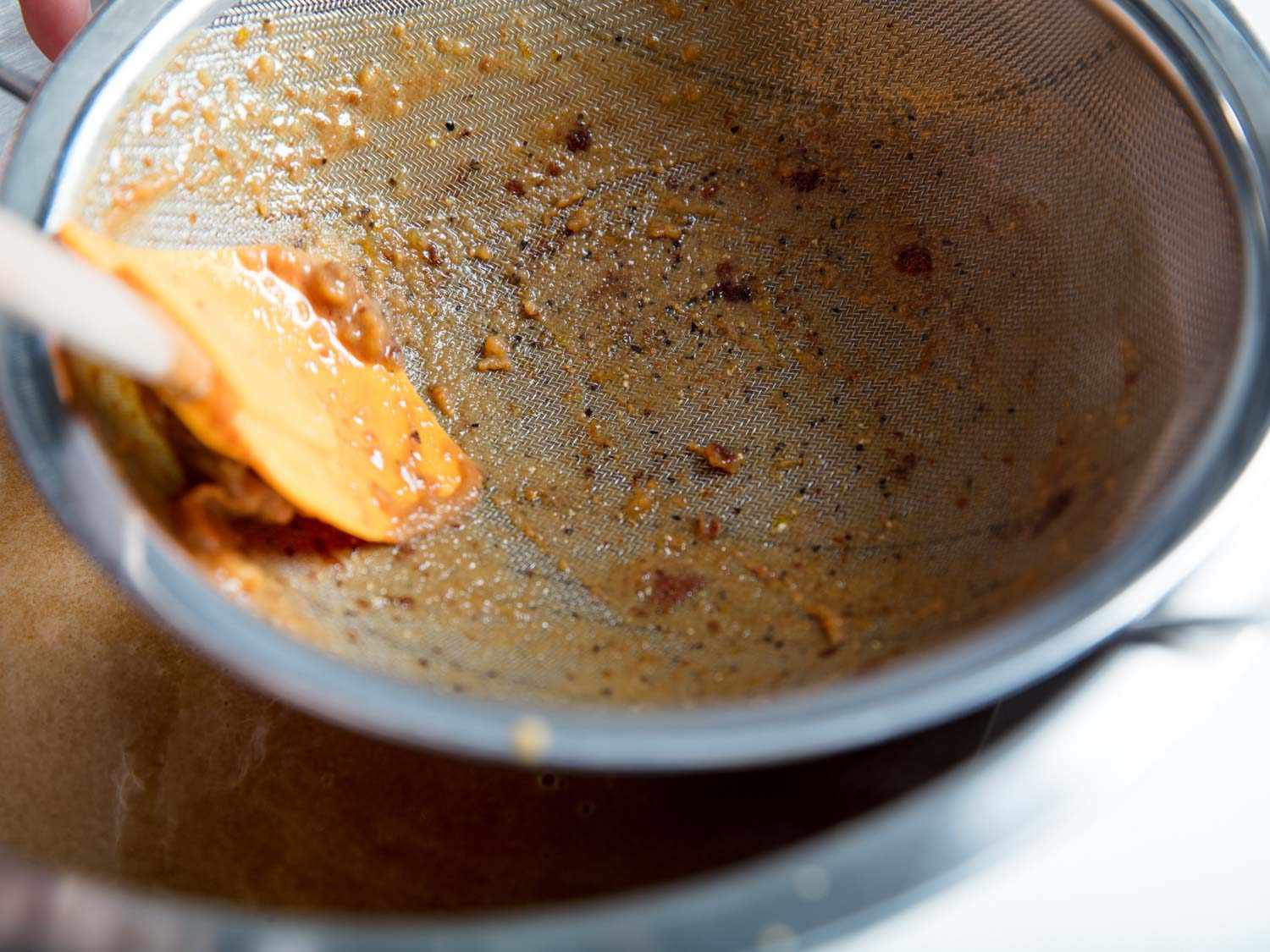 straining the gingerbread ice cream