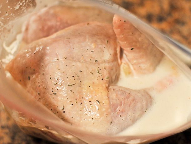 The marinated chicken in a ziptop bag.